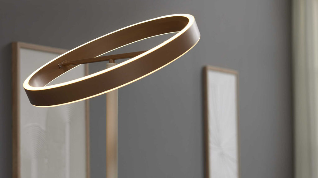 Moderner beigefarbener LED-Fluter in Ringform mit flexiblem Lesearm